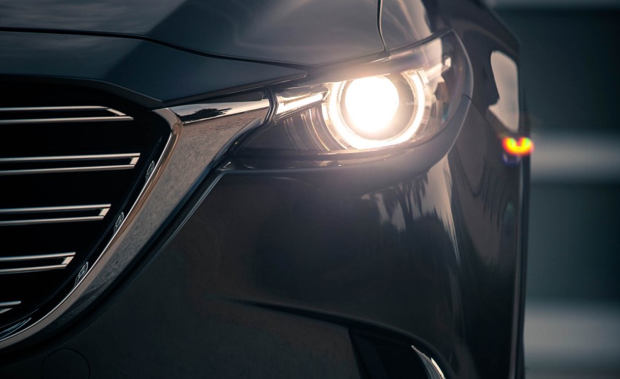 Đánh giá xe Mazda CX-9 2016: Cụm đèn pha được thiết kế liền mạch với lưới tản nhiệt.