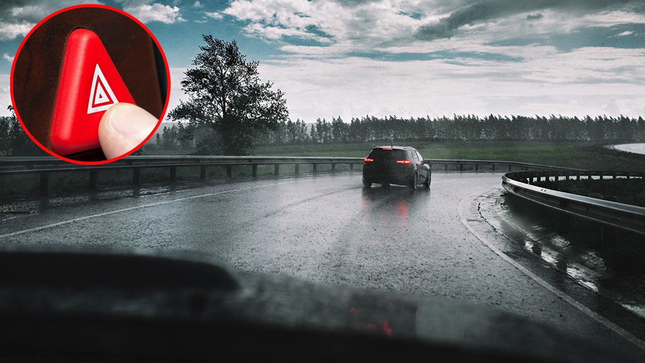 Bật đèn cảnh báo nguy hiểm khi lái xe trong điều kiện trời mưa.