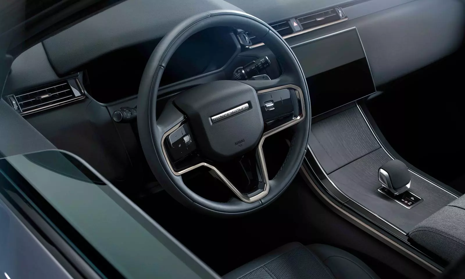 Khoang nội thất Range Rover Velar 2025 thiết theo phong cách tối giản nhưng sang trọng và tràn ngập công nghệ tiện nghi.
