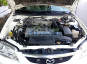 Cần bán lại xe Mazda 323 đời 2003, màu trắng, xe nhập