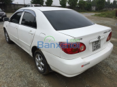 Cần bán xe Toyota Corolla J, màu trắng, sản xuất năm 2003