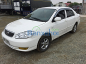 Cần bán xe Toyota Corolla J, màu trắng, sản xuất năm 2003