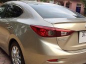 Cần bán xe Mazda 3 sedan đời 2015, màu vàng