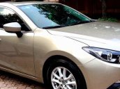 Cần bán xe Mazda 3 sedan đời 2015, màu vàng