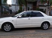 Cần bán lại xe Ford Laser Ghia 1.8 MT đời 2003, màu trắng xe gia đình