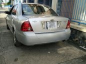 Kẹt tiền bán gấp Ford Laser đời 2004, màu bạc