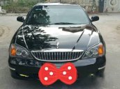 Cần bán xe Daewoo Magnus đời 2004, màu đen xe gia đình