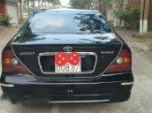 Cần bán xe Daewoo Magnus đời 2004, màu đen xe gia đình