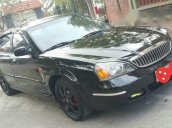 Cần bán xe Daewoo Magnus đời 2004, màu đen xe gia đình