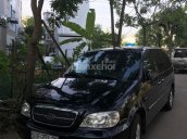 Bán xe Kia Carnival 2009 máy xăng màu đen, tặng thêm phụ kiện