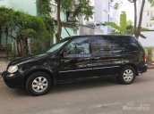 Bán xe Kia Carnival 2009 máy xăng màu đen, tặng thêm phụ kiện