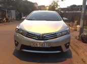 Tôi cần bán lại xe Toyota Corolla altis AT 2015, màu bạc số tự động