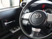 Cần bán xe Toyota FJ Cruiser, Sx 2007, màu vàng, nội thất đen, ghế bọc nỉ
