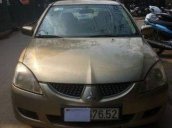 Bán xe Mitsubishi Lancer AT đời 2004, màu vàng  