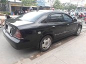 Cần bán lại xe Daewoo Magnus đời 2004, màu đen số tự động