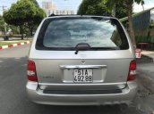 Gia đình cần bán xe Kia Carnival AT đời 2010, màu bạc, số tự động