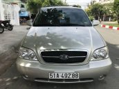 Gia đình cần bán xe Kia Carnival AT đời 2010, màu bạc, số tự động