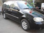 Chính chủ bán Kia Carnival AT đời 2009, màu đen, giá chỉ 320 triệu