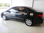 Cần bán xe cũ Toyota Corolla Altis 1.8G đời 2010, màu đen