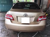 Cần bán xe Toyota Camry LE 2010, màu vàng, nhập khẩu