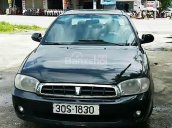 Cần bán gấp Kia Spectra đời 2005, màu đen xe gia đình