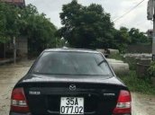 Cần bán Mazda 323 đời 2002, màu đen