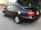 Cần bán xe Toyota Camry đời 2004, màu đen