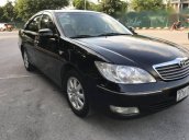 Cần bán xe Toyota Camry đời 2004, màu đen