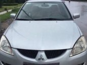 Gia đình bán xe Mitsubishi Lancer đời 2003, màu bạc