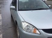 Gia đình bán xe Mitsubishi Lancer đời 2003, màu bạc