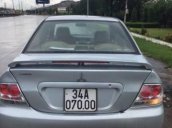 Gia đình bán xe Mitsubishi Lancer đời 2003, màu bạc