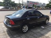 Cần bán gấp Ford Laser 1.8 đời 2003, màu đen xe gia đình