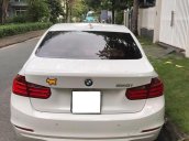 Bán xe BMW 320i đăng kí 2014, màu trắng, chính chủ, được bảo dưỡng định kì tại hãng