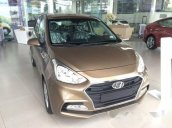 Cần bán xe Hyundai Grand i10 1.2 AT đời 2017, màu vàng cát  