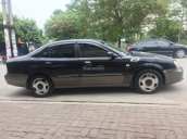 Cần bán lại xe Daewoo Magnus đời 2004, màu đen