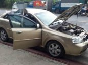 Cần bán xe Daewoo Lacetti đời 2004, màu ghi vàng  