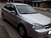 Cần bán gấp Daewoo Lacetti đời 2010, màu bạc số sàn