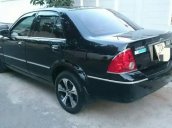 Bán xe Ford Laser GHIA 1.8AT đời 2004, màu đen