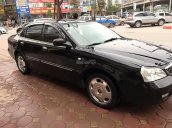 Cần bán gấp Daewoo Magnus đời 2004, màu đen số tự động