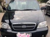 Bán xe Kia Carnival đời 2009, màu đen  