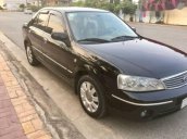 Gia đình bán Ford Laser 1.8 GHIA đời 2004, màu đen