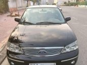 Gia đình bán Ford Laser 1.8 GHIA đời 2004, màu đen