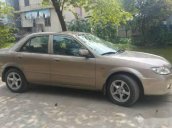 Bán Mazda 323 năm sản xuất 2002, màu vàng cát