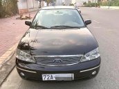 Bán ô tô Ford Laser GHIA 1.8 MT đời 2004, màu đen xe gia đình, giá chỉ 225 triệu