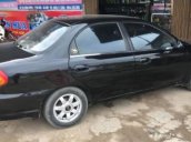 Cần bán xe Kia Spectra năm sản xuất 2003, màu đen