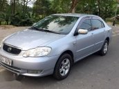 Cần bán Toyota Corolla Altis đời 2002, màu bạc xe gia đình