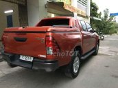 Bán xe Toyota Hilux 2.5E sản xuất năm 2016, màu cam, giá tốt