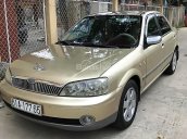 Chính chủ bán Ford Laser GHIA 1.8 MT đời 2002, màu vàng