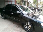 Cần bán xe Kia Spectra sản xuất 2005, màu đen chính chủ  