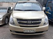 Bán Hyundai Starex số sàn, máy dầu, nhập khẩu Hàn Quốc 2012 bản ghế xoay, màu vàng cát, biển Sài Gòn